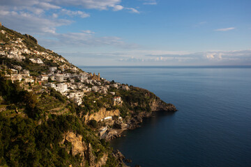 Rocky Coastline with Turquoise Sea under Dramatic Sky