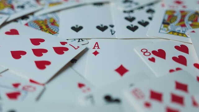 Close-up of playing cards with smooth panning and sliding motion