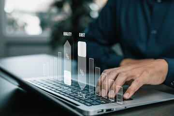 Hand typing on laptop with virtual graphs showing high quality and low cost relationship, representing business analysis, cost efficiency, and performance management.