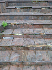 Crumbling staircase reveals the passage of time and nature reclaiming a forgotten path