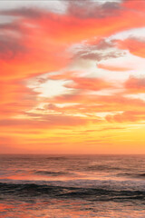 Vibrant Orange and Pink Sky Above the Sea