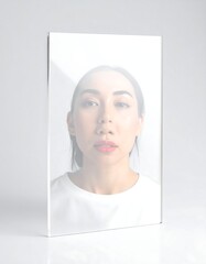 Woman's portrait behind translucent acrylic