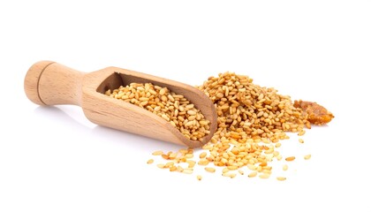 Wooden scoop full of sesame seeds