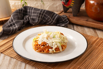 Chicken tinga toast, a traditional Mexican home-cooked dish consisting primarily of chicken cooked with chipotle chili and lots of onion, is traditionally eaten on 