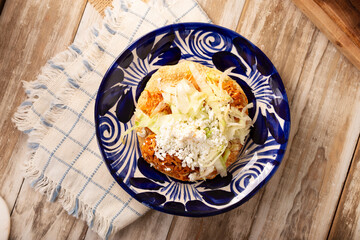 Chicken tinga toast, a traditional Mexican home-cooked dish consisting primarily of chicken cooked with chipotle chili and lots of onion, is traditionally eaten on 