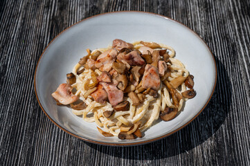 Plate of chicken and mushroom pasta. 