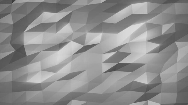 Abstract gray polygon background with faceted triangular textures and shaded gradients for minimal design