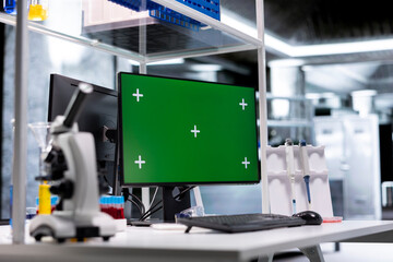 Mockup display on monitor running in empty research facility with advanced lab equipment for molecular analysis and pharmacology. Bioscience setting reflects discovery and scientific precision.