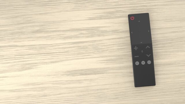 Smart TV remote control on wooden desk, top view