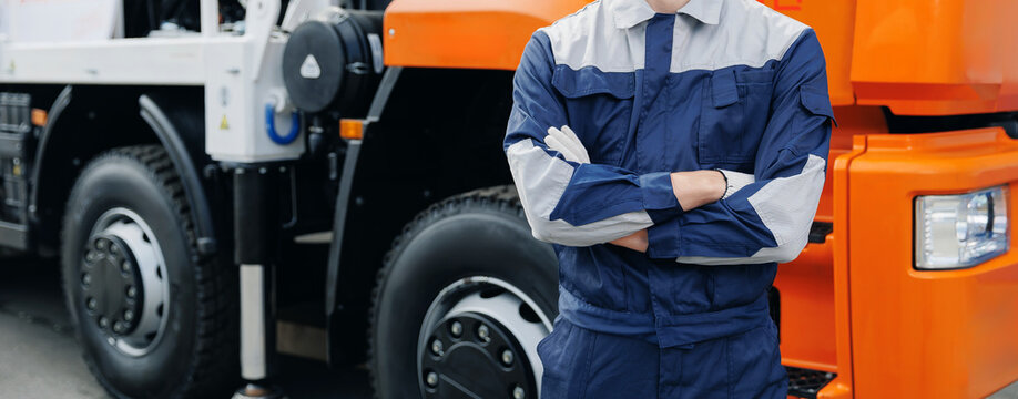 Banner industrial driver worker in uniform on background large vehicle truck