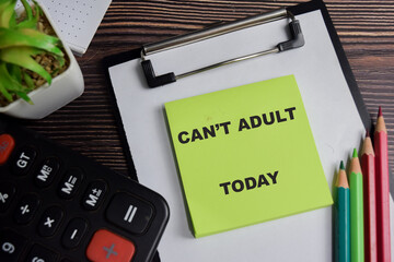 Concept of can't adult today write on sticky notes isolated on Wooden Table.