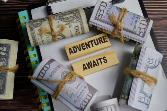 Adventure awaits on stacked wooden cubes on the table. Business and finance concept - Powered by Adobe