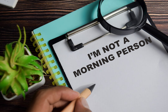 Concept of I'm not a morning person write on clipboard isolated on Wooden Table. - Powered by Adobe