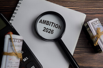 Concept of ambition 2026 write on book with keywords isolated on Wooden Table.