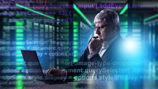 IT specialist with laptop working in server room, programming and analyzing code for cybersecurity and data management. Information Technology, Cybersecurity.