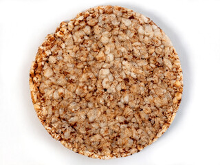 Puffed brown rice cake isolated on a white background