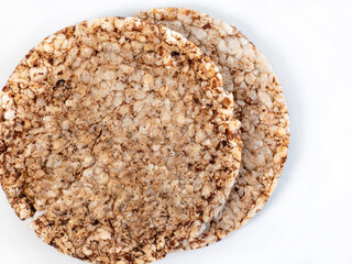 Two crunchy puffed rice cakes isolated on a white background
