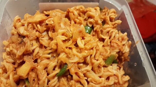 Spiral macaroni Pasta ready for eat. Fusilli pasta with tomato creamy sauces, tonno, green chilli, and olive oil.  
