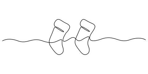 Obraz premium Continuous one line drawing of Christmas socks. Christmas sock icon. Single line drawn background. Vector illustration