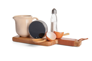 Digital kitchen timer and dishware on white background