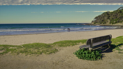Lorne , Victoria Australia. A peaceful beach scene with a wooden bench