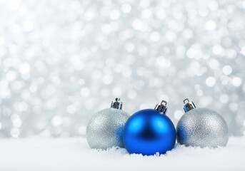 Christmas ornaments in snow with a bokeh background, festive holiday season