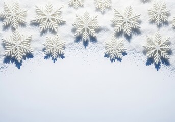 White snowflakes on snow, winter holiday background with copy space