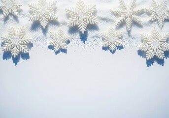 White snowflakes on snow, winter holiday background with copy space
