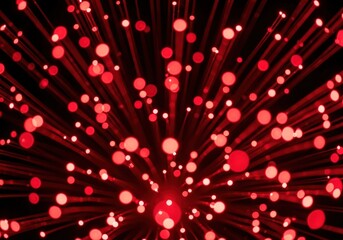 Abstract red light burst with bokeh effect against a dark background
