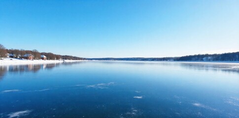 Fototapeta premium Rideau Canal Skating Rink, Winter Serenity A wide, frozen expanse of the Rideau Canal in Ottawa, Canada, during a clear, sunny winter day. The ice is smooth and reflects the bright blue sky and