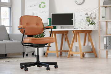 Brown leather swivel chair in room, closeup