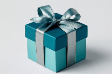 Obraz premium A Charming Small Gift Box with a Beautiful Silver Ribbon Perfect for Special Occasions such as Birthdays, Anniversaries, or Surprise Gifts