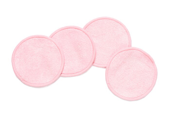 Reusable pink cotton pads on white background