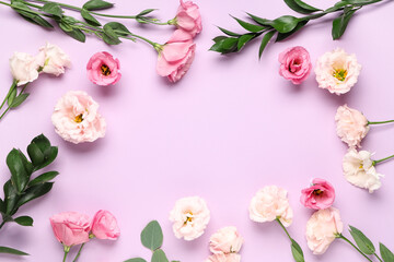 Frame made of different beautiful flowers on purple background