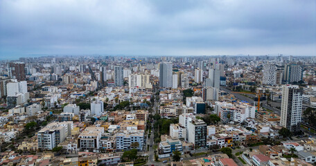 Cloudy afternoon over the endless city of Lima seen from above.