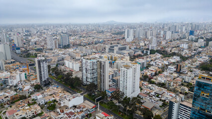 Cityscape of Lima seen from above on a slightly overcast day.