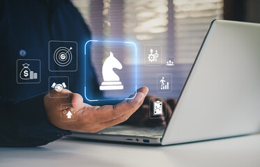 Digital business strategy and innovation planning concept showing chess knight icon with financial growth, teamwork and process management symbols, corporate decision-making, strategic leadership © LAONG