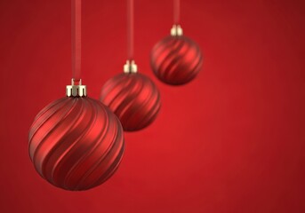 Elegant red Christmas ornaments hanging against a vibrant red background