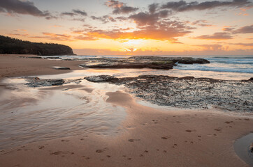 Coastal beach landscape with sunrise sky