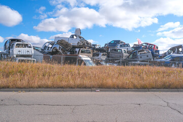 Scarped cars at a vehicle junk scrapyard