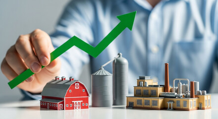 Hand holding green arrow up over farm and factory model, growth concept