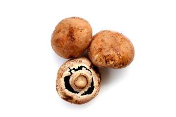 Fresh portobello mushrooms with visible gills underneath.