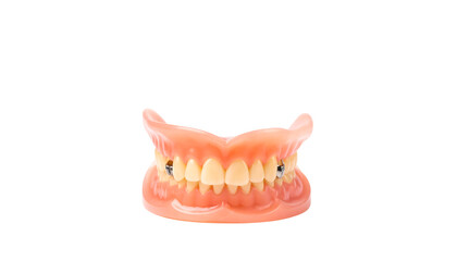 Obraz premium An isolated set of dentures with pink gums and yellowed teeth, including two metal implants, transparent png