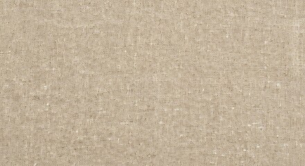 Closeup of a coarsely woven light tan linen fabric showing its irregular texture and natural fibers
