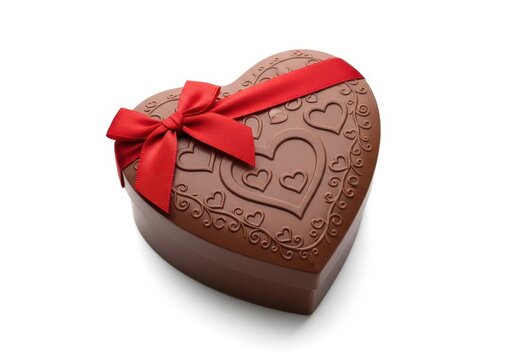 Heart shaped chocolate box tied with red ribbon isolated on white background
