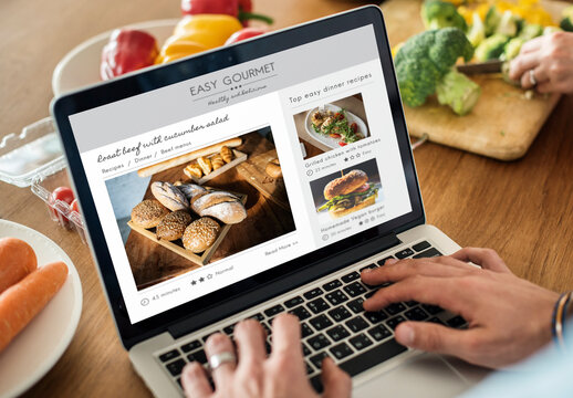 Caucasian Man Using A Laptop Mockup In The Kitchen