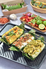 Grilled rice with its variations, wrapped in banana leaves, a traditional Indonesian food