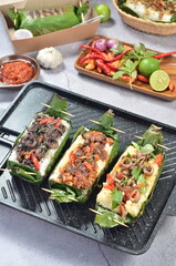 Grilled rice with its variations, wrapped in banana leaves, a traditional Indonesian food