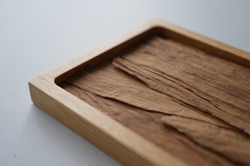 Close up of a wooden tray with natural grain texture
