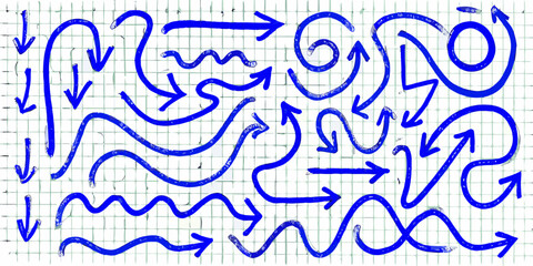 Collection of hand drawn blue arrows and wavy lines on a grid paper background